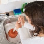unclogging kitchen sink